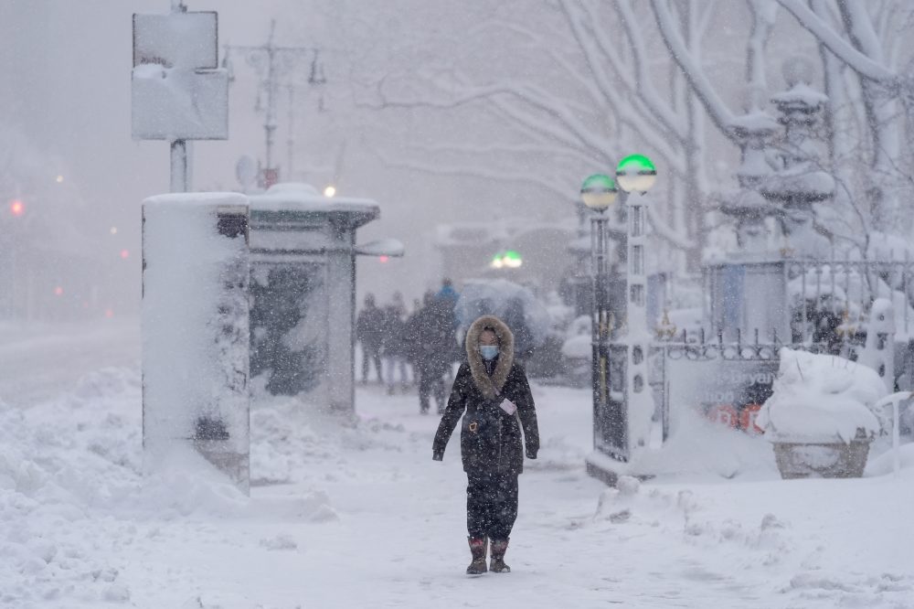 The Latest: Snowfall intensifies in Northeast as many are under blizzard warnings and travel bans