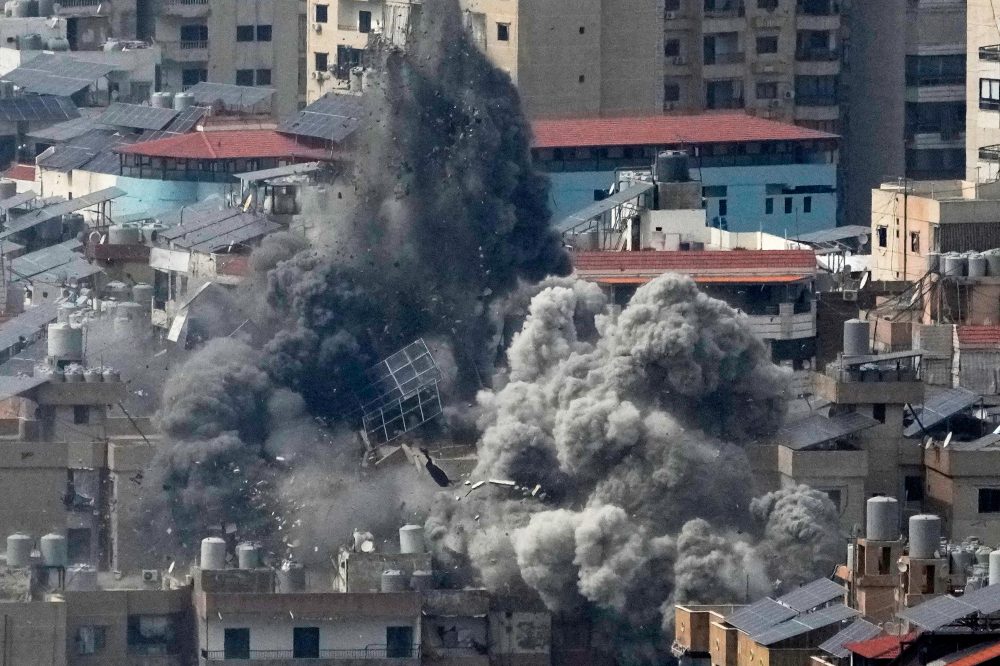 The Latest: Israel hammers Beirut and Tehran as Iran attacks more Israeli targets