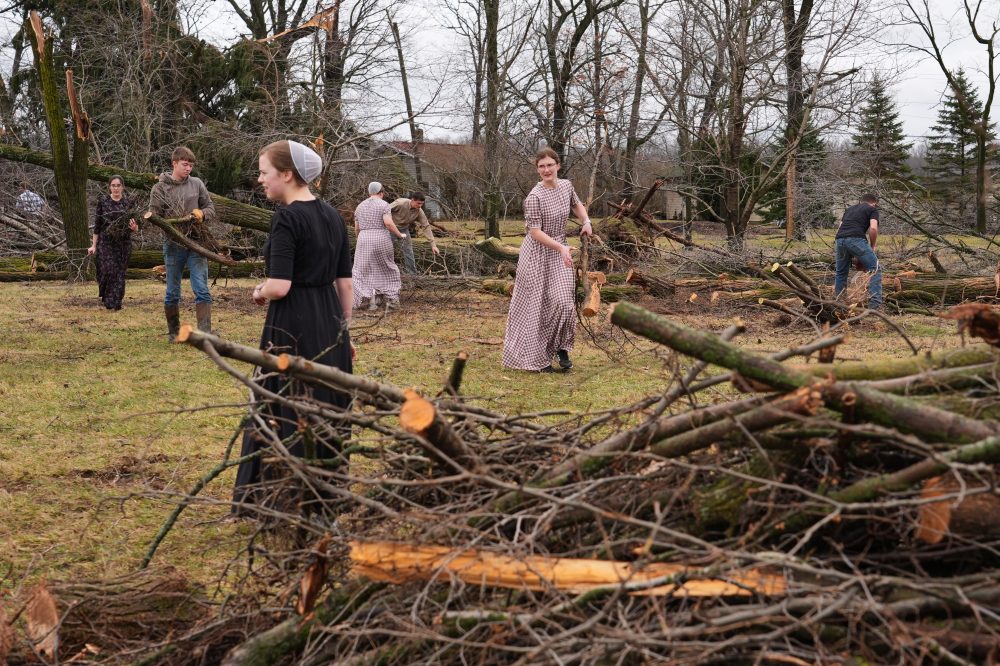 Photos show damage left by powerful storms as volunteers help communities clean up