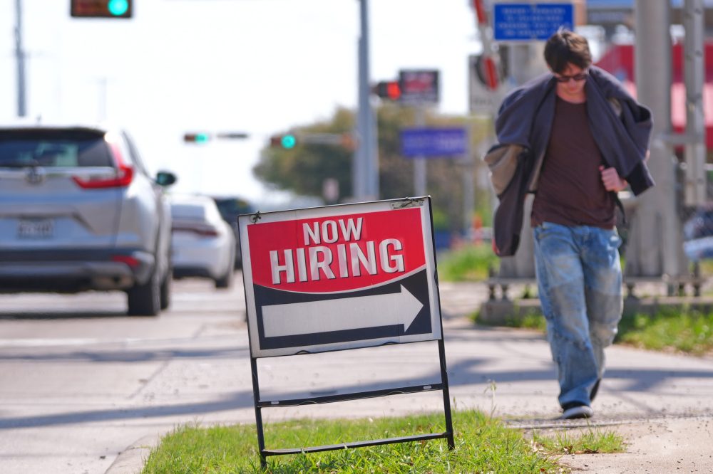 US filings for jobless aid tick up last week to 210,000 but remain at historically healthy levels