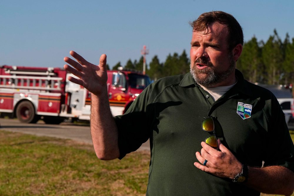 Southern US wildfires force residents to flee, leaving them unsure if their homes are standing