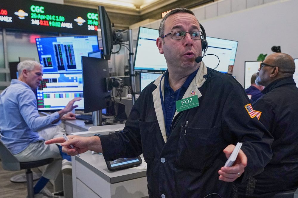 Asian shares are mixed and oil gains more than $1 as Iran talks remain in flux