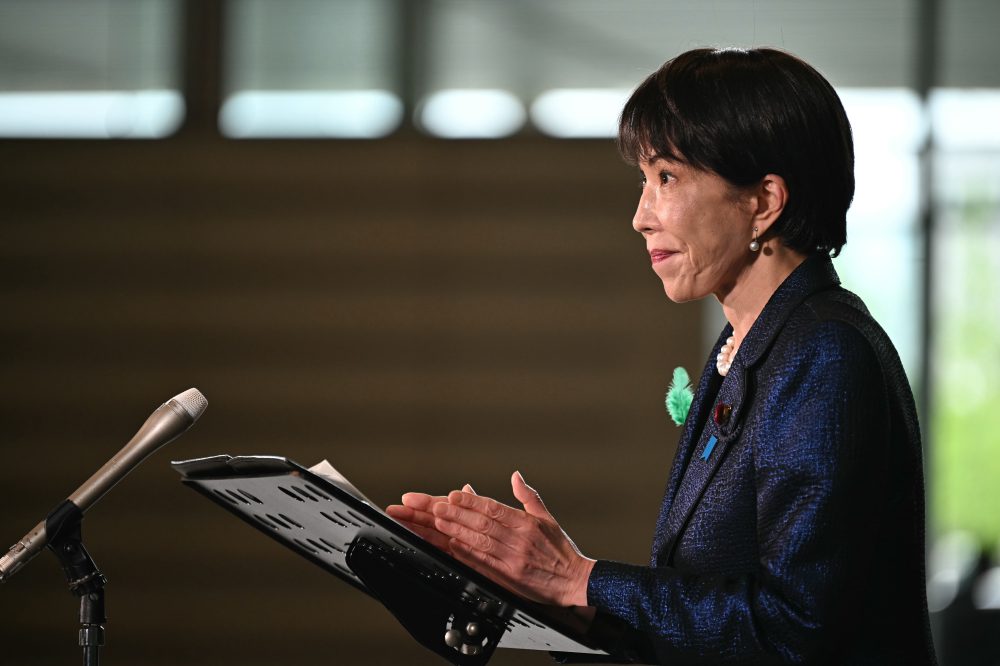 Japan’s prime minister launches a panel to review her country’s defense policies as threats escalate