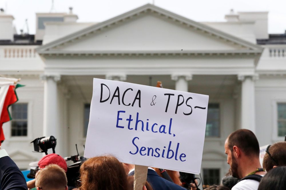 The Latest: Supreme Court to hear arguments on ending legal protections for Haitian/Syrian migrants