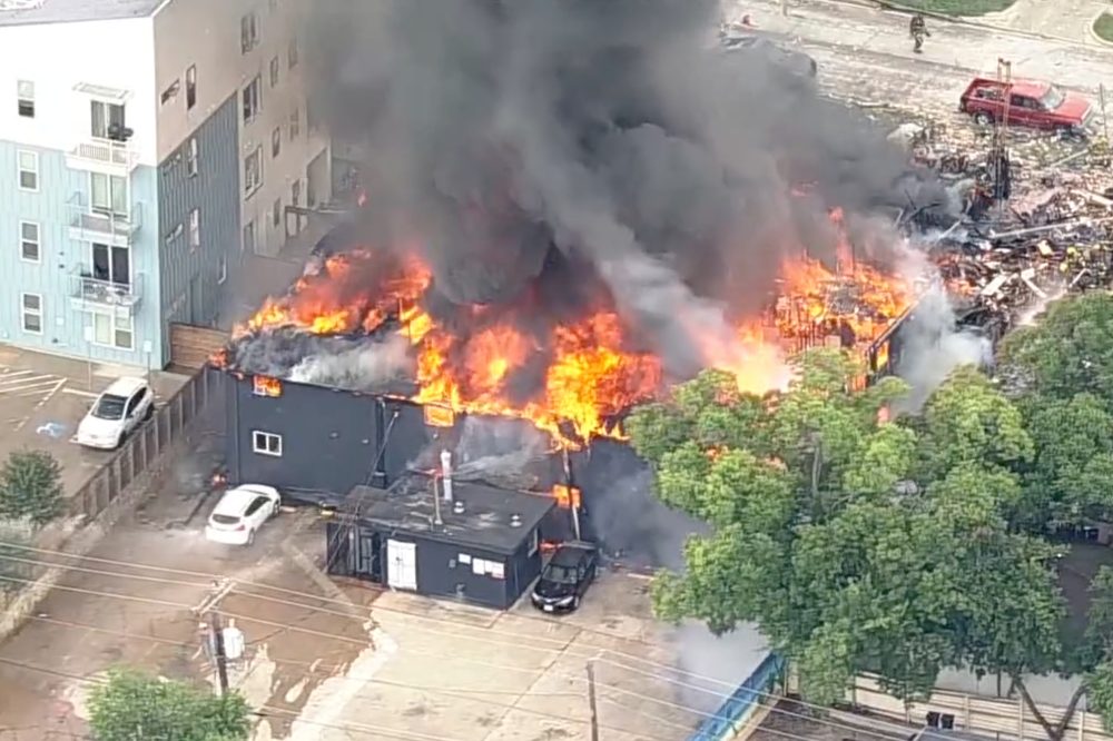 Fire destroys an apartment building in Dallas and at least 4 people are injured, fire official says