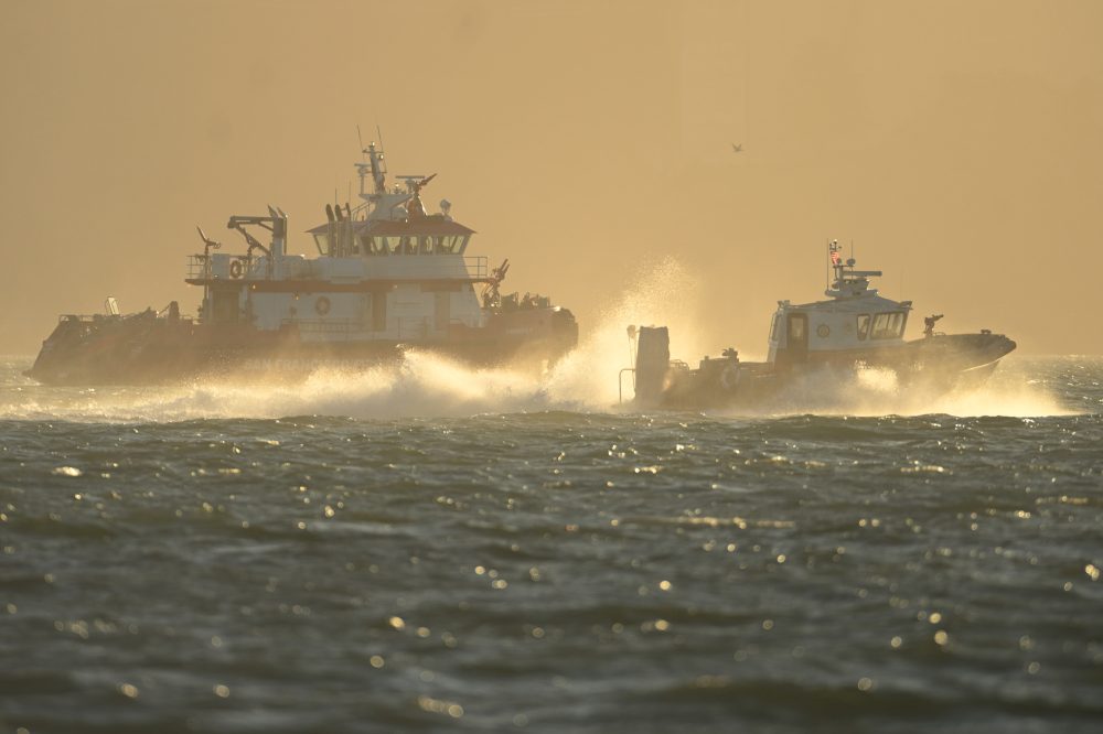 Search and rescue operation for a sunken pontoon boat near Alcatraz Island, in photos