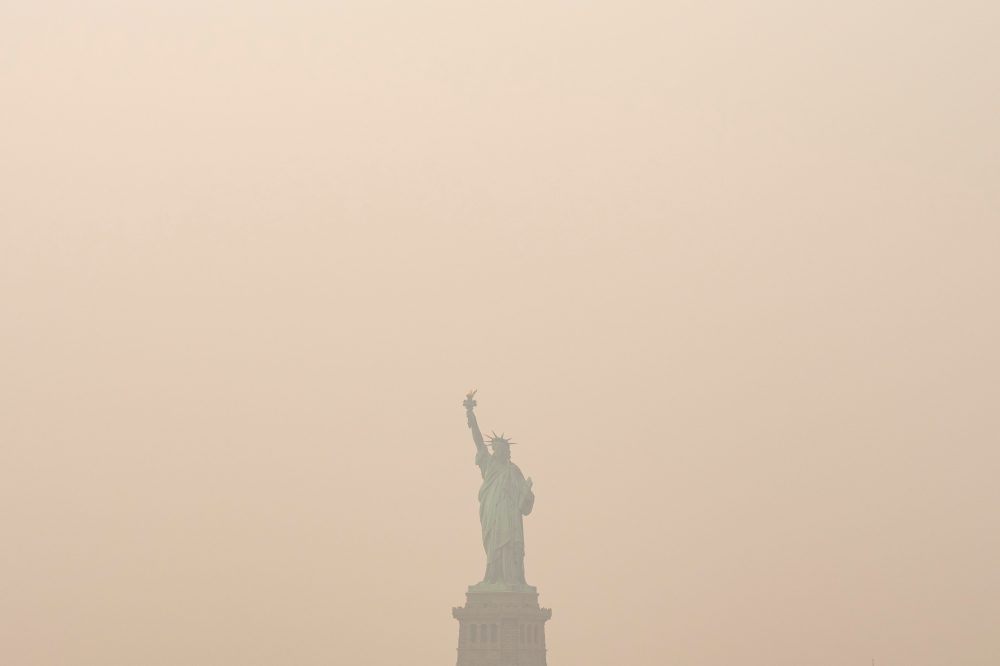 Heavy smoke from wildfires is darkening skies from the US Midwest to the East Coast, in photos