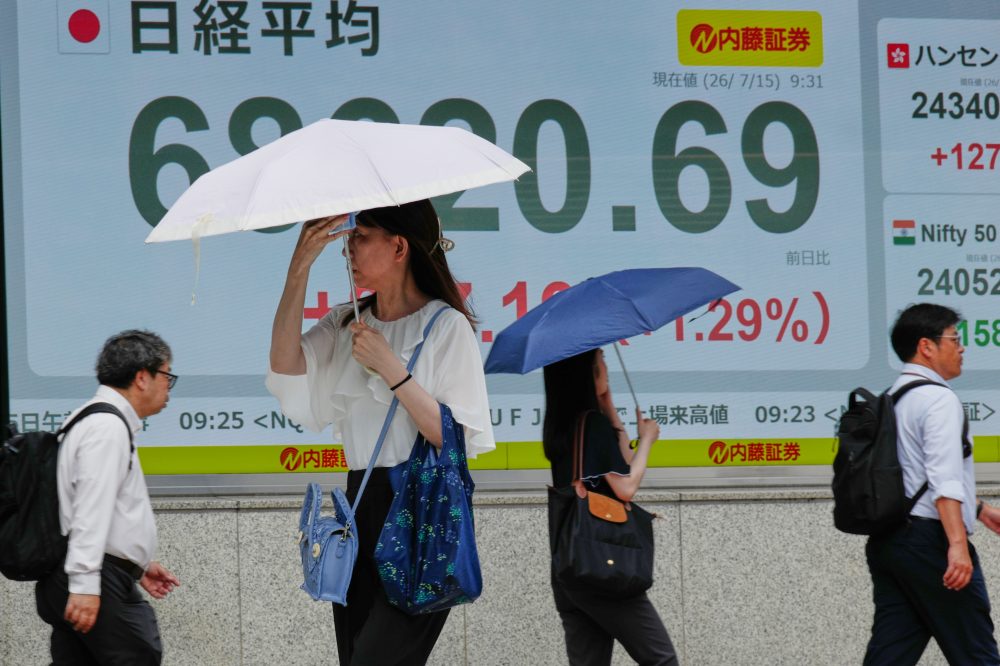 Asian shares are mostly higher and Mideast tensions push Brent crude past $97