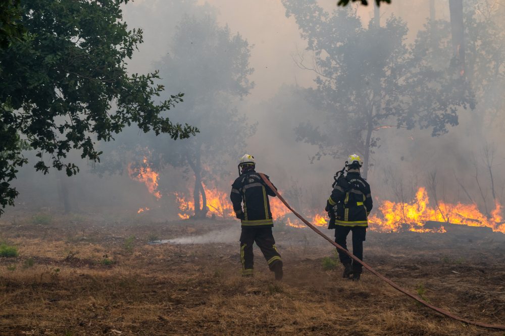 France and Spain battle wildfires as more than 250,000 people are forced to flee homes