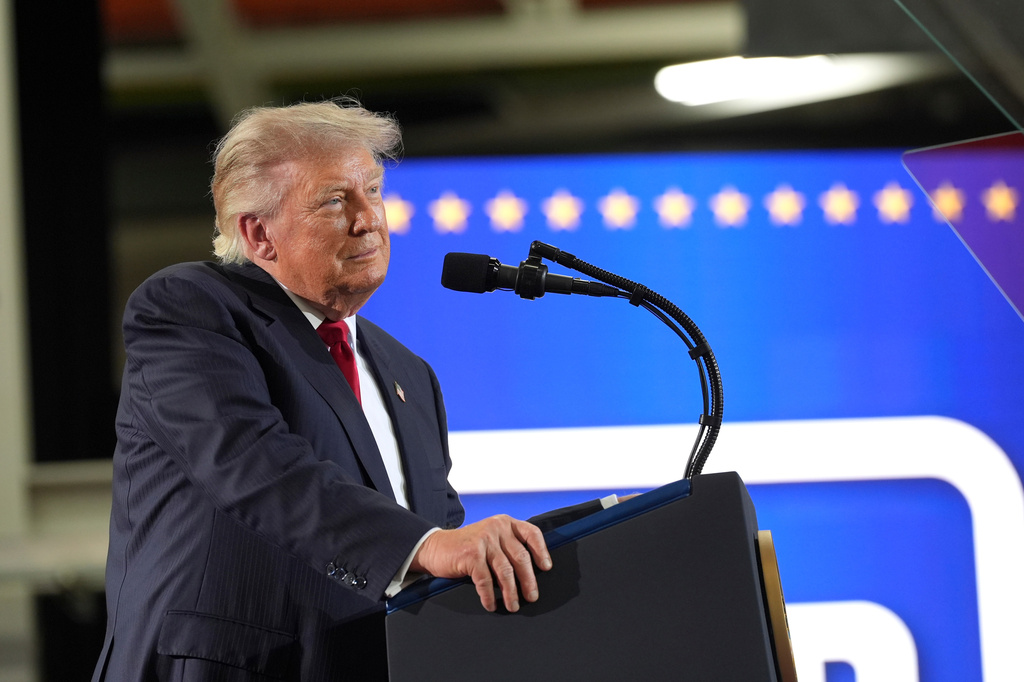 Trump defends his tariffs during Michigan visit