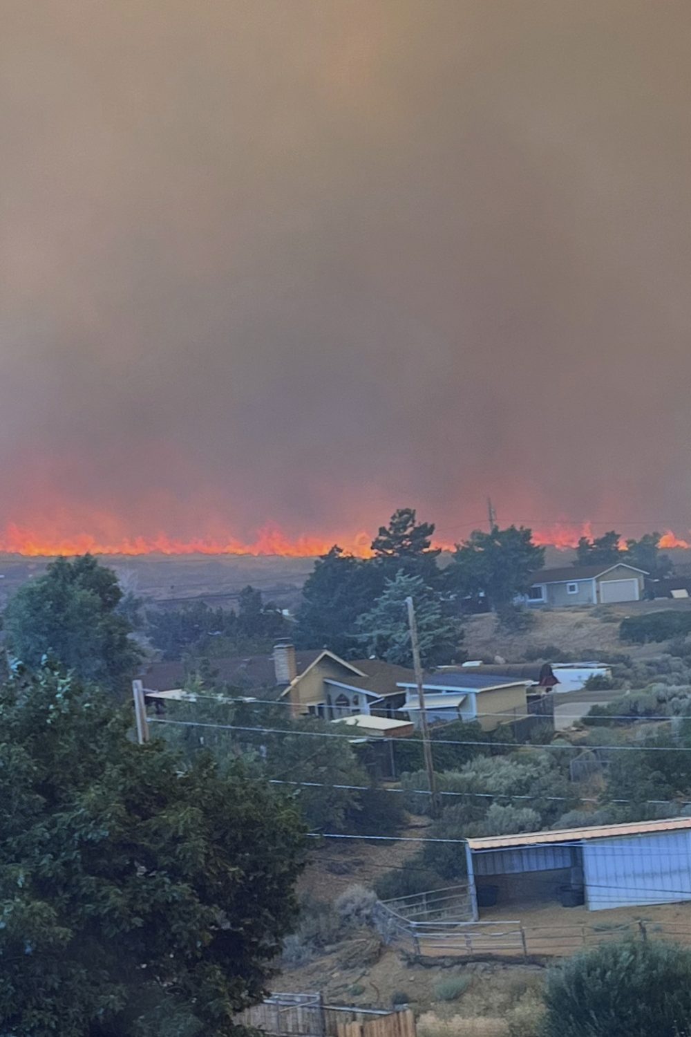 Wildfire approaches Reno, Nevada, forcing thousands to evacuate their neighborhoods