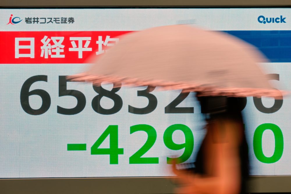 Asian stocks are mixed after Wall Street retreats following economic updates