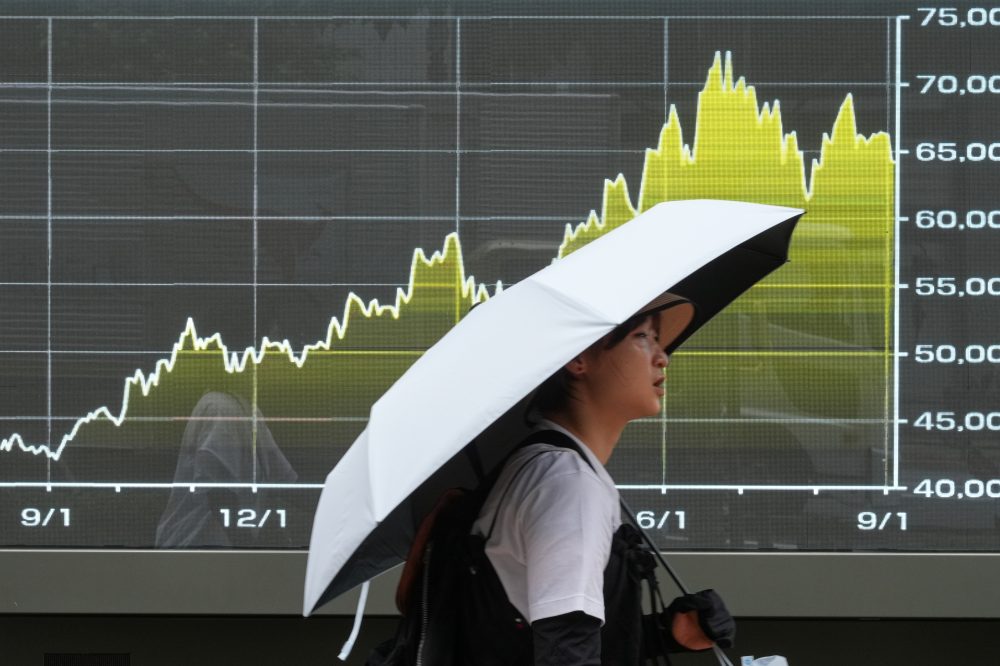 Asian benchmarks trade mixed following rally on Wall Street led by technology issues