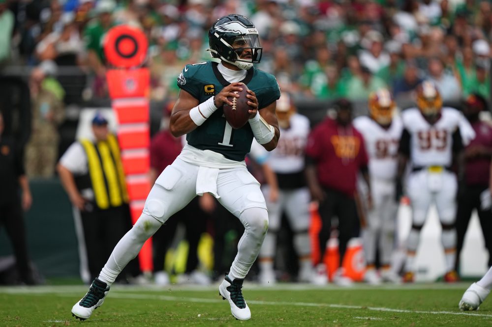 Jalen Hurts throws 3 TD passes and Eagles stuff Commanders’ late 2-point try for 24-22 win
