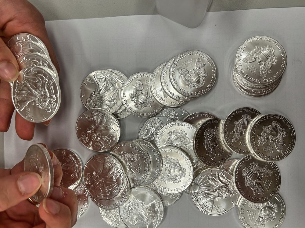 A tip about a swerving van leads police to 66,000 US silver coins in a fraud case