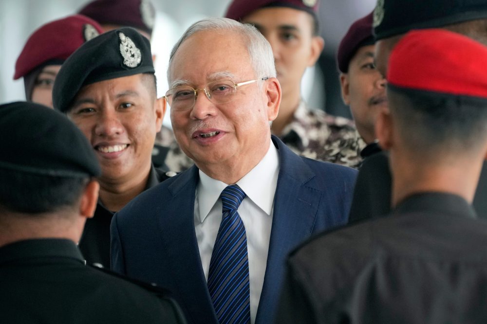 Malaysia’s king allows former leader Najib to serve rest of his graft sentence under house arrest